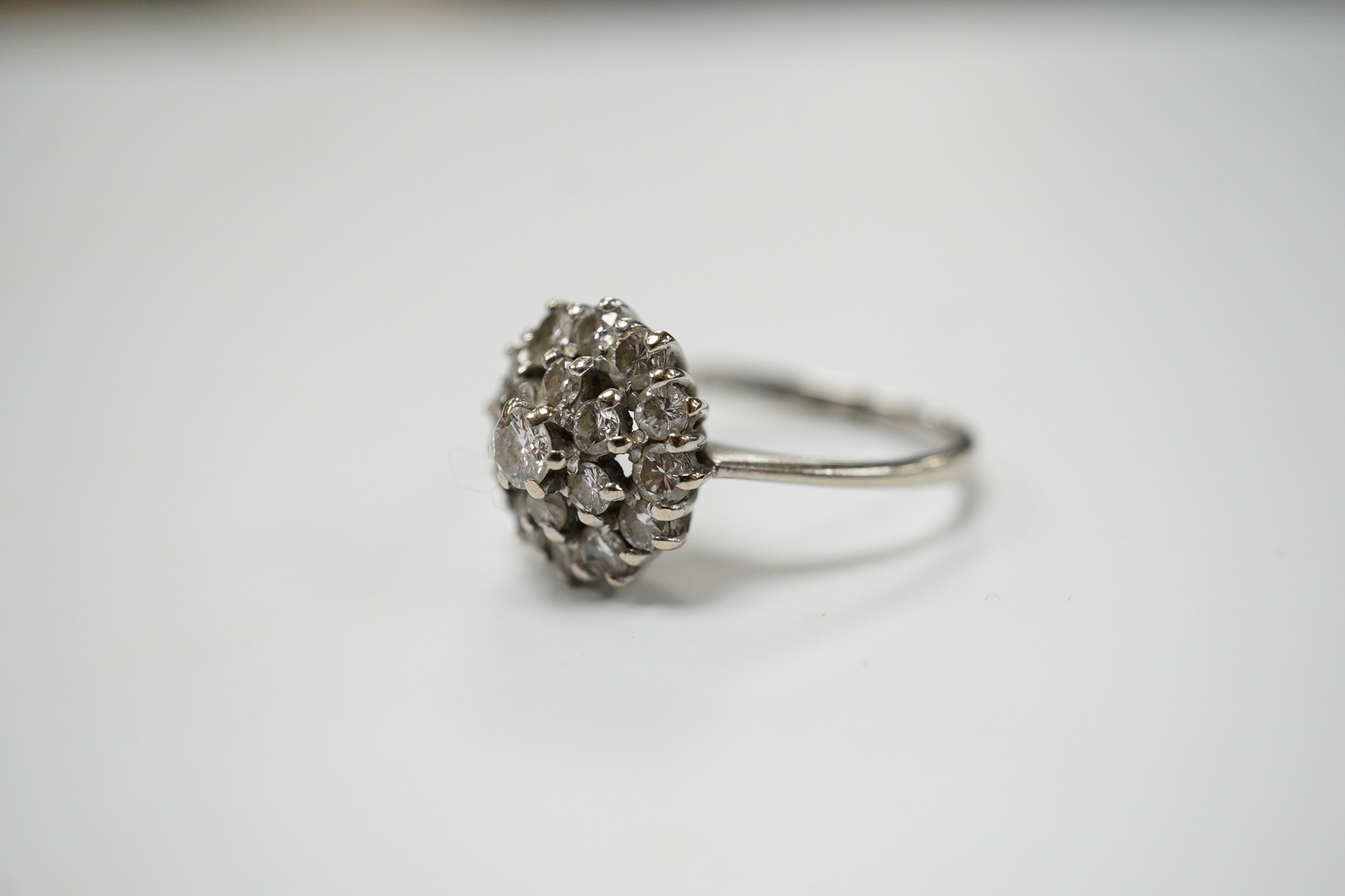 A 1970's 18ct white gold and diamond cluster set ring, size L, gross weight 3.2 grams, Condition - fair to good